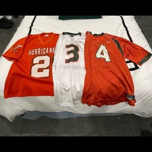 2 Nike and 1 vintage Large Miami Hurricanes jerseys